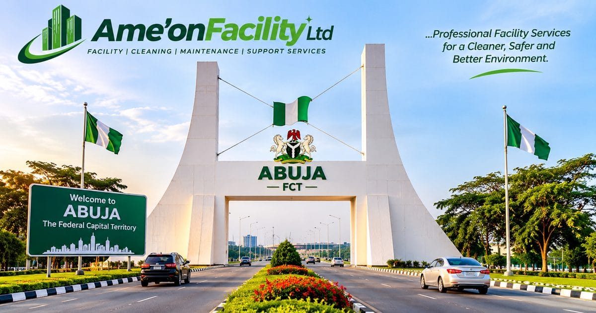 Abuja entrance monument with Nigerian flags and AME’ON FACILITY LTD branding (illustrative image)